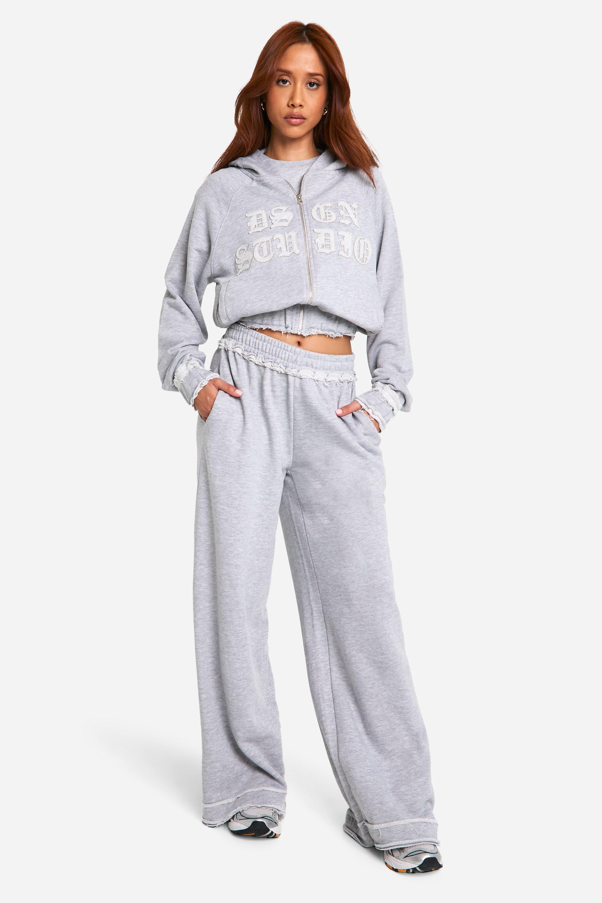 Jogging droit dechire a slogan Dsgn Studio
